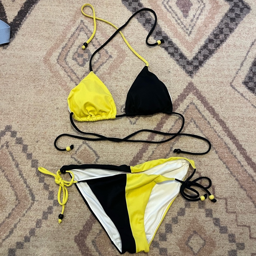 Black and yellow color, black triangle bikini from Victoria’s Secret size medium